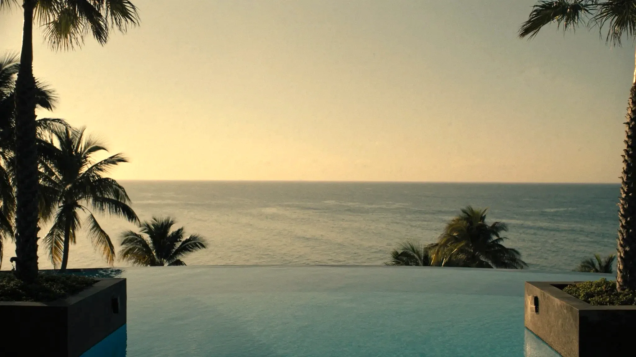 Resort pool at golden hour (placeholder)